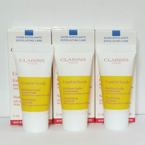 Clarins  Comfort Scrub Питательное отшелушивающее масло для лица с  микрокристаллами сахара.