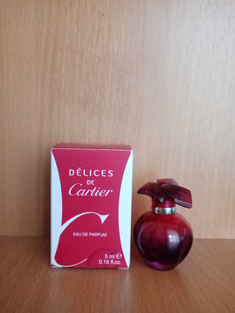 Флакон (пустой) от аромата Delices Cartier.