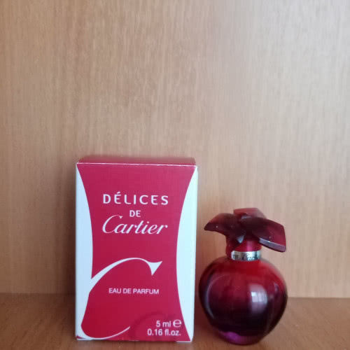 Флакон (пустой) от аромата Delices Cartier.